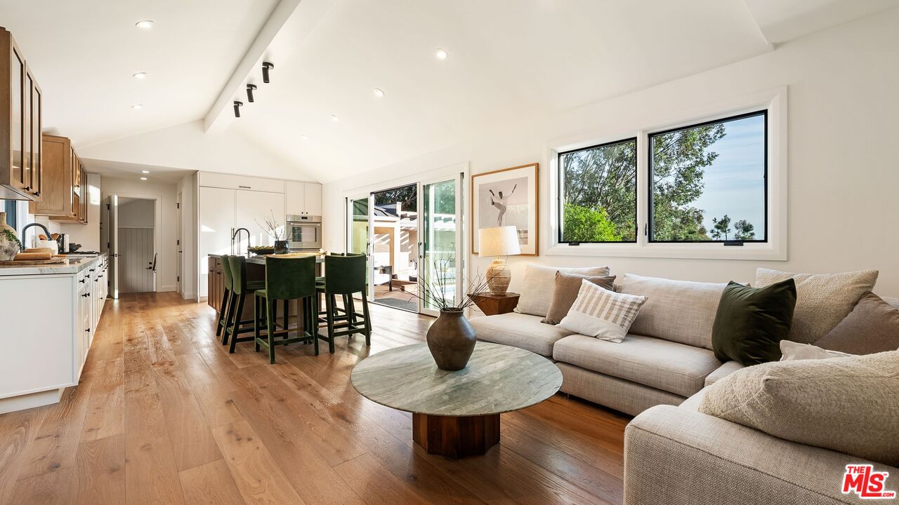 13146 Rivers Road Los Angeles, CA 90049 - Photo 13 of 42 a living room with furniture and a large window