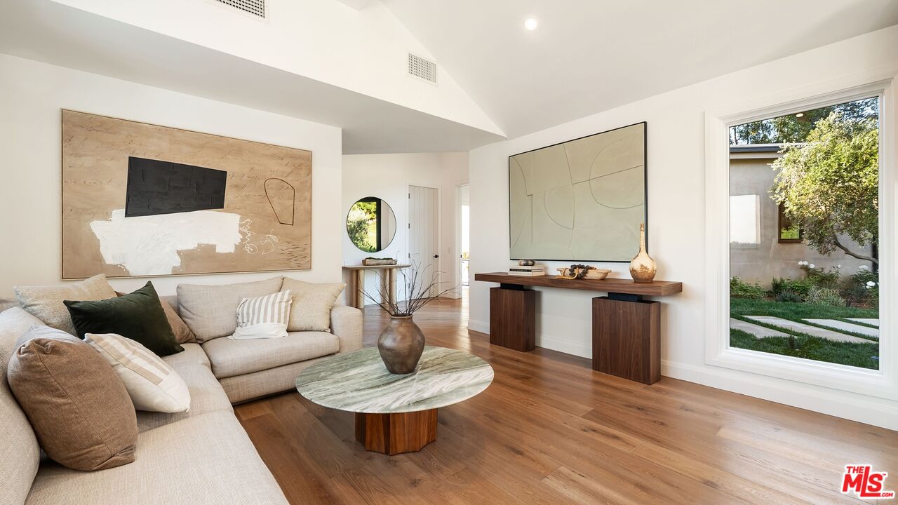 13146 Rivers Road Los Angeles, CA 90049 - Photo 14 of 42 a living room with furniture and a large window