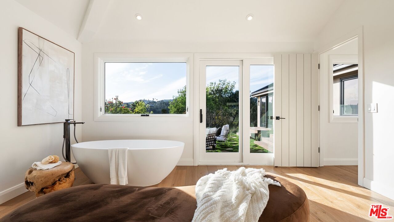 13146 Rivers Road Los Angeles, CA 90049 - Photo 21 of 42 a bed room with a bed and a window