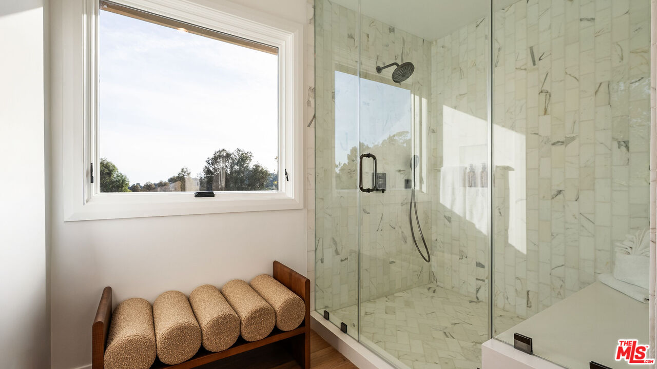 13146 Rivers Road Los Angeles, CA 90049 - Photo 22 of 42 a bathroom with a shower and a sink