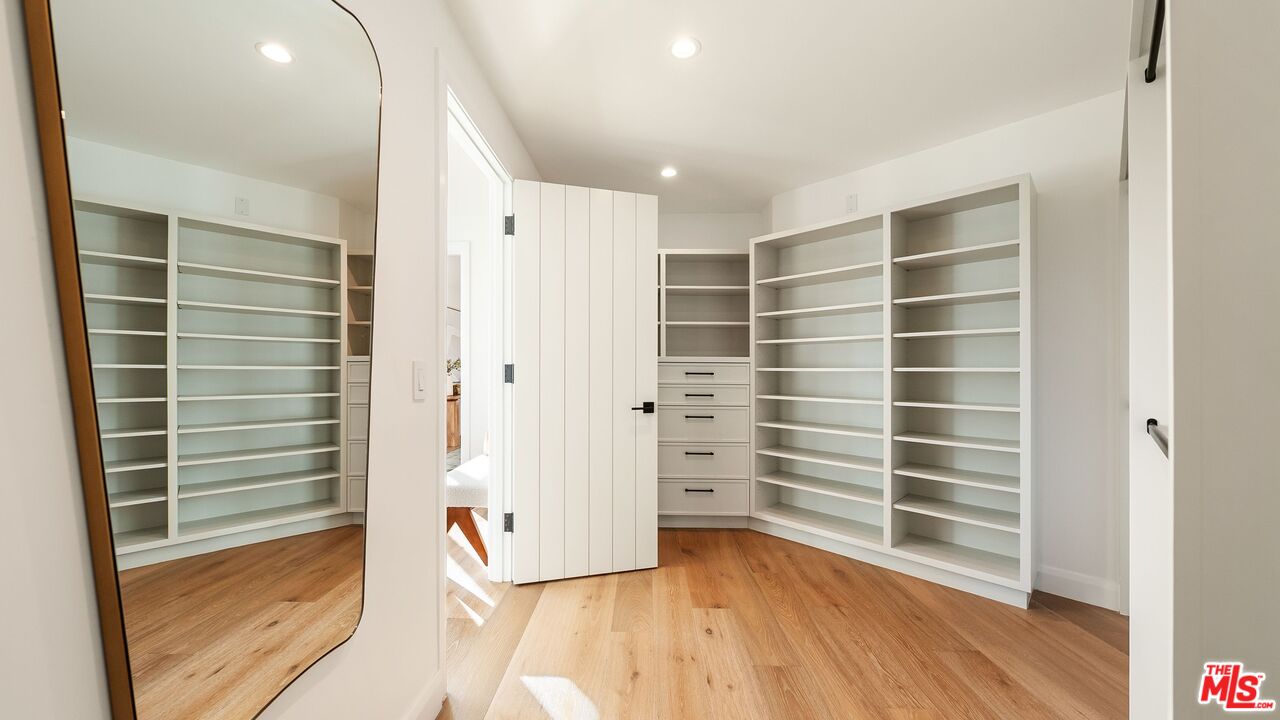 13146 Rivers Road Los Angeles, CA 90049 - Photo 23 of 42 a view of walk in closet with empty racks