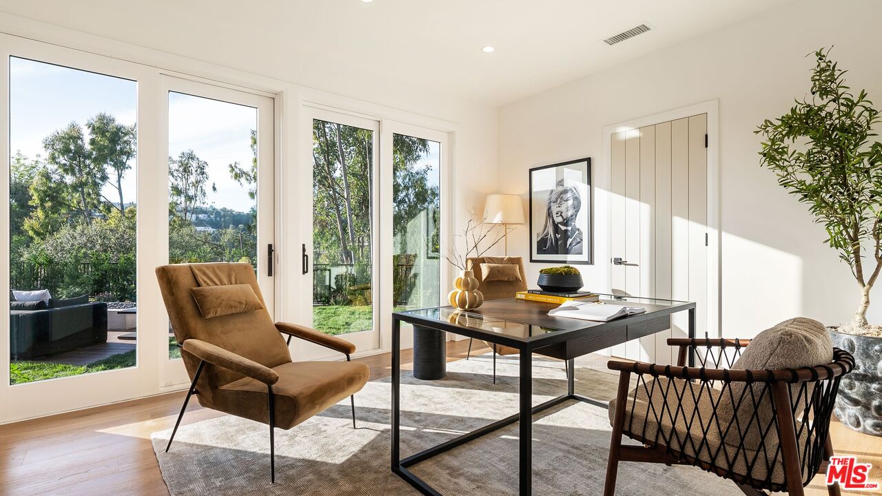 13146 Rivers Road Los Angeles, CA 90049 - Photo 24 of 42 a living room with furniture and wooden floor