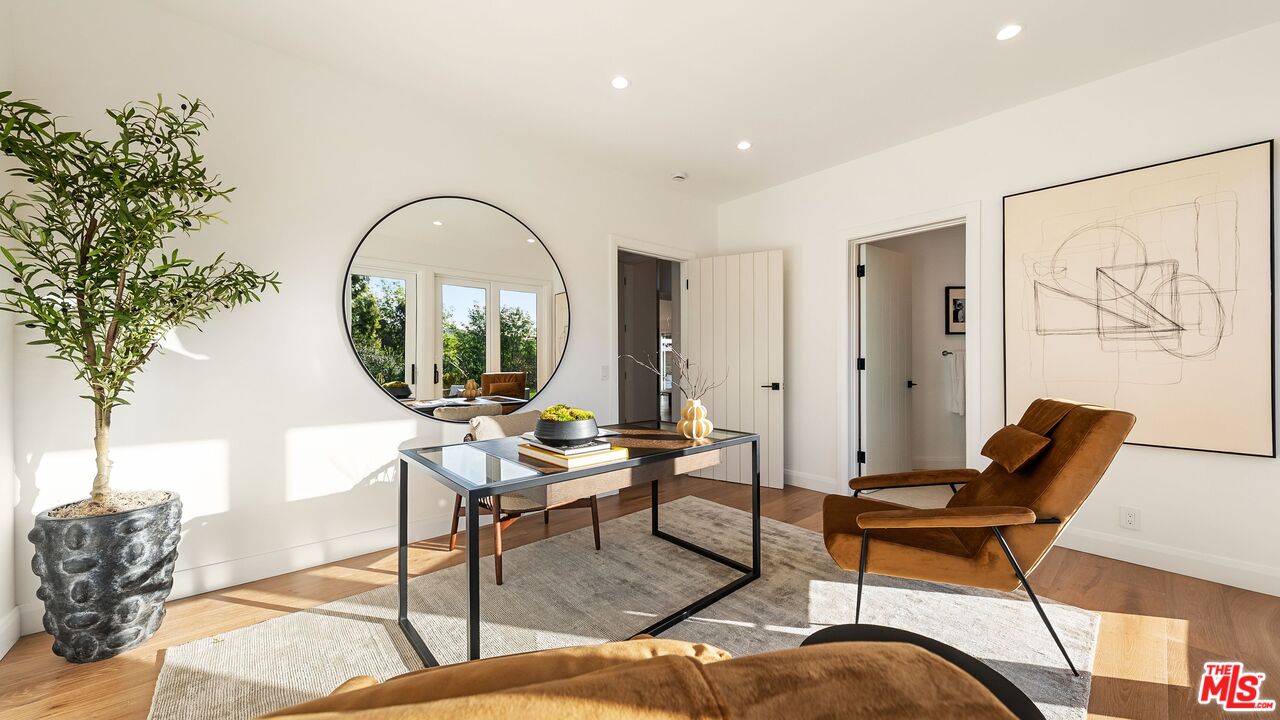 13146 Rivers Road Los Angeles, CA 90049 - Photo 25 of 42 a living room with furniture a table and a large window