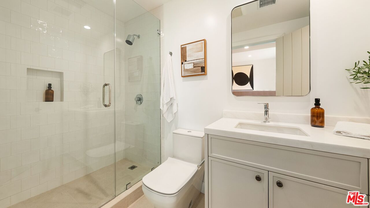 13146 Rivers Road Los Angeles, CA 90049 - Photo 28 of 42 a bathroom with a sink toilet vanity and shower