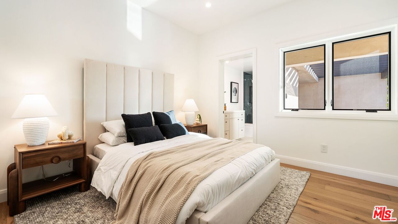 13146 Rivers Road Los Angeles, CA 90049 - Photo 32 of 42 a bedroom with a bed and a window