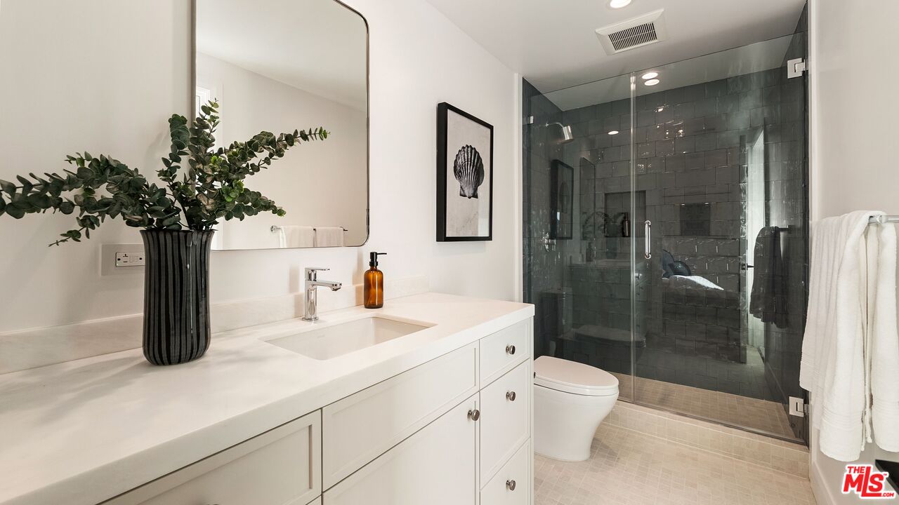 13146 Rivers Road Los Angeles, CA 90049 - Photo 33 of 42 a bathroom with a sink a toilet and shower