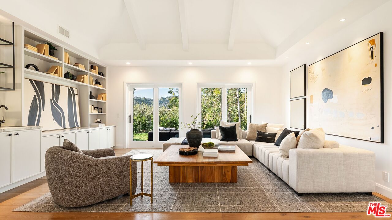 13146 Rivers Road Los Angeles, CA 90049 - Photo 5 of 42 a living room with furniture and a large window