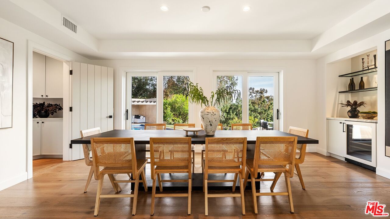 13146 Rivers Road Los Angeles, CA 90049 - Photo 7 of 42 a view of a dining room with furniture and wooden floor