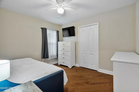 a dining room with furniture a fireplace and a large window