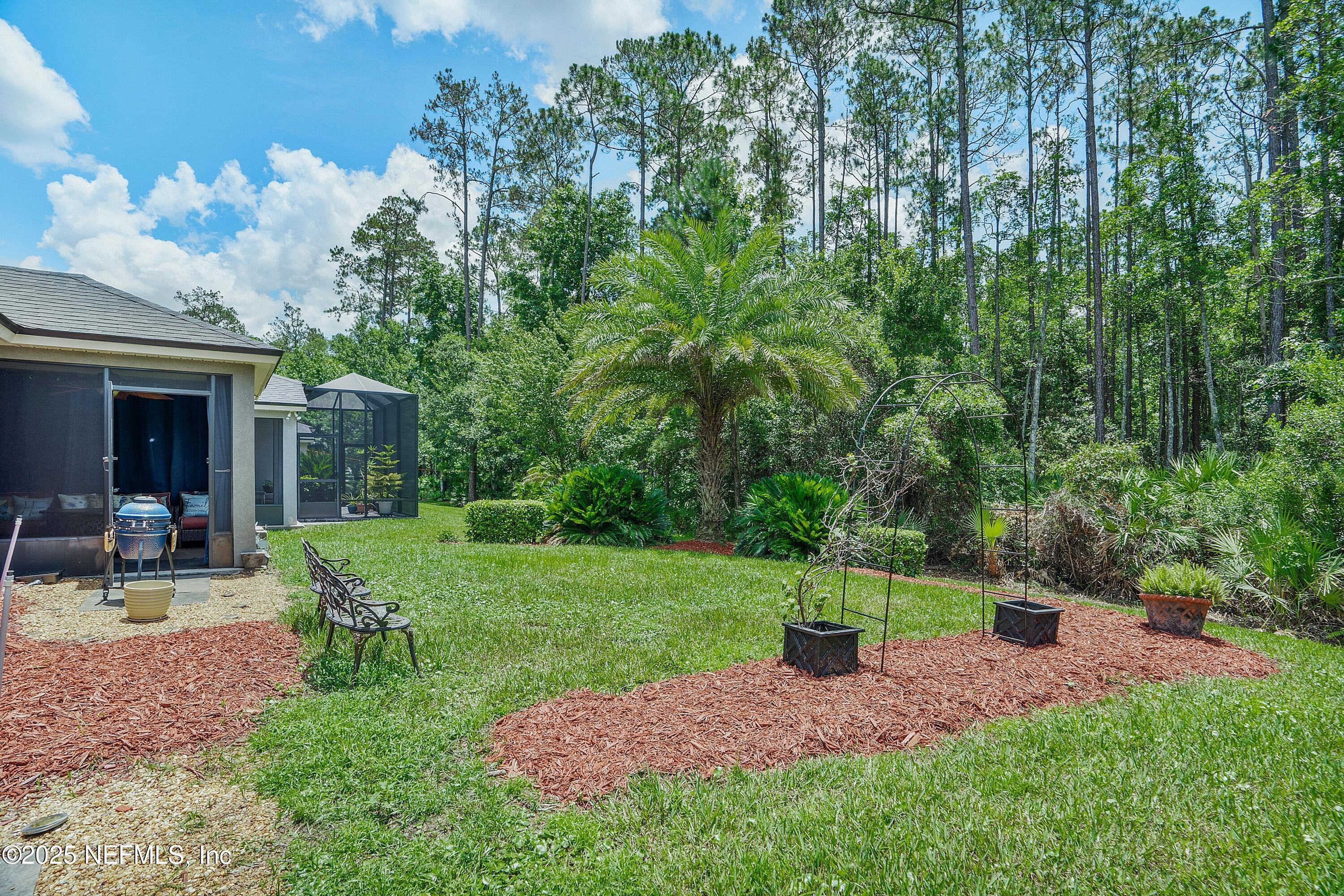 78 Wayfare Lane Jacksonville, FL 32081 - Photo 33 of 61 a view of a chair and table in backyard of the house