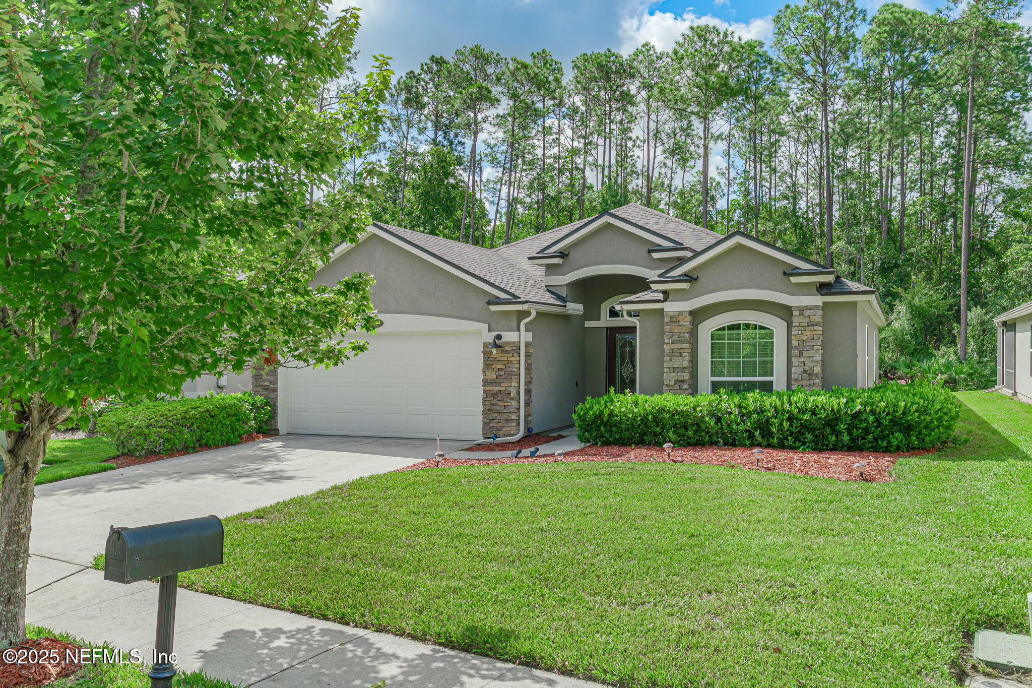78 Wayfare Lane Jacksonville, FL 32081 - Photo 61 of 61 a front view of a house with a yard and garage