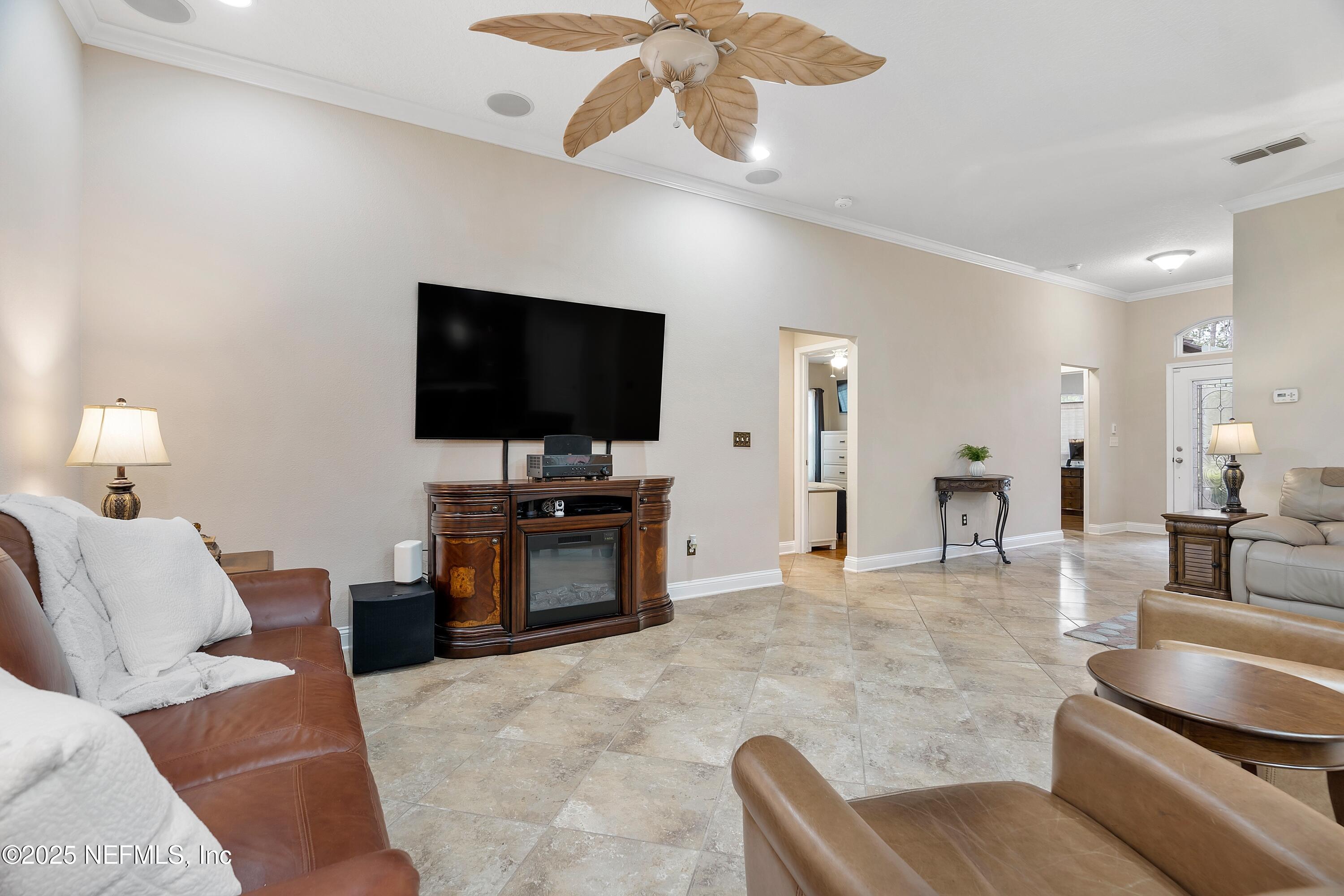 78 Wayfare Lane Jacksonville, FL 32081 - Photo 10 of 61 a living room with furniture and a flat screen tv