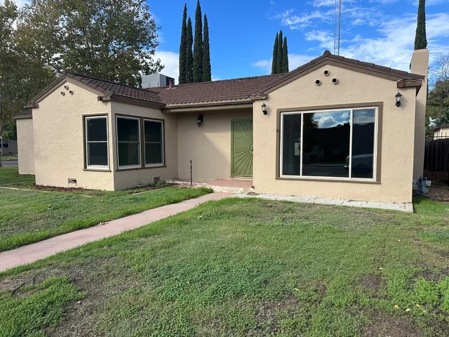 a front view of a house with a yard