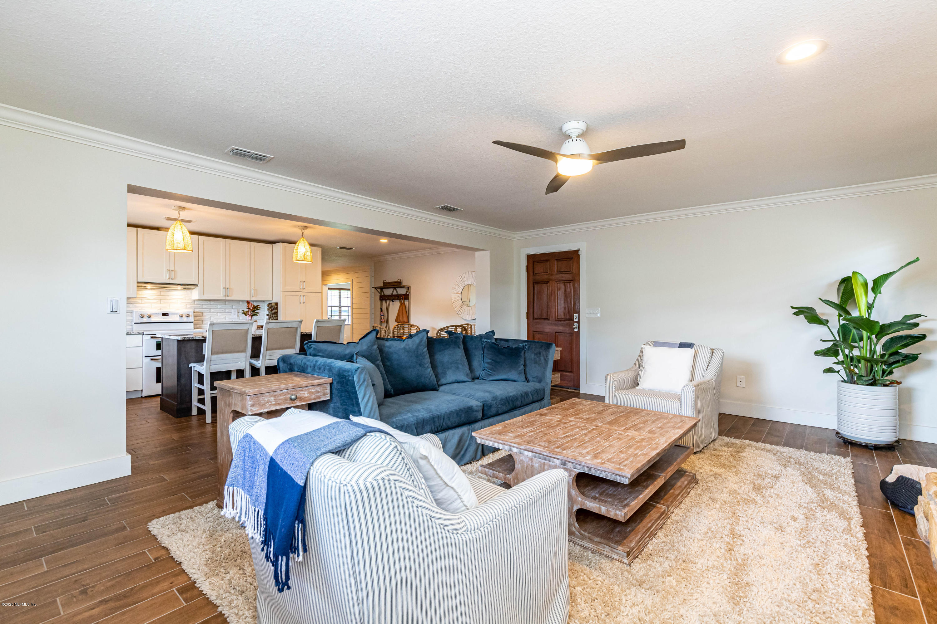 20 Amberjack Road Ponte Vedra Beach, FL 32082 - Photo 16 of 37 a living room with furniture potted plant and a window