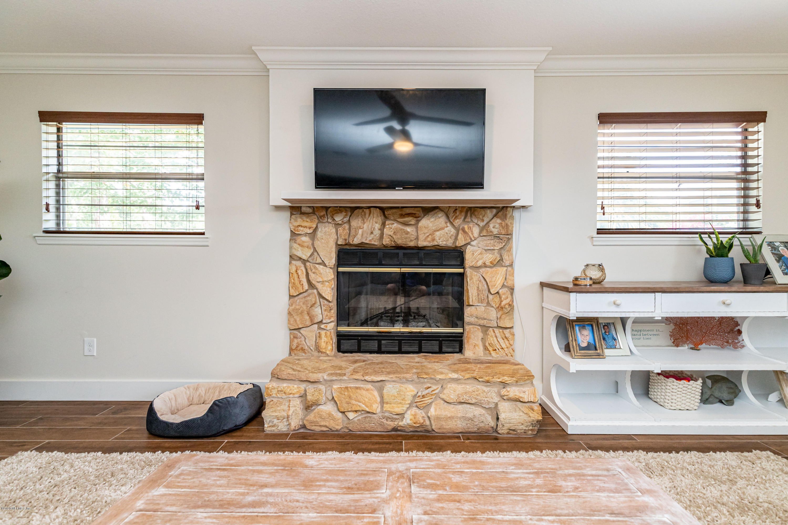 20 Amberjack Road Ponte Vedra Beach, FL 32082 - Photo 18 of 37 a living room with furniture and a fireplace