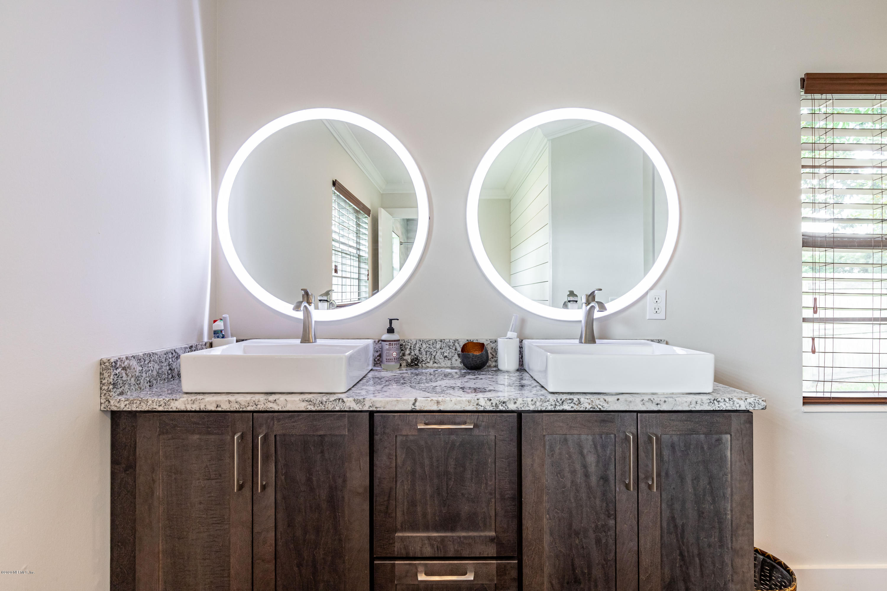 20 Amberjack Road Ponte Vedra Beach, FL 32082 - Photo 23 of 37 a bathroom with double vanity and a mirror