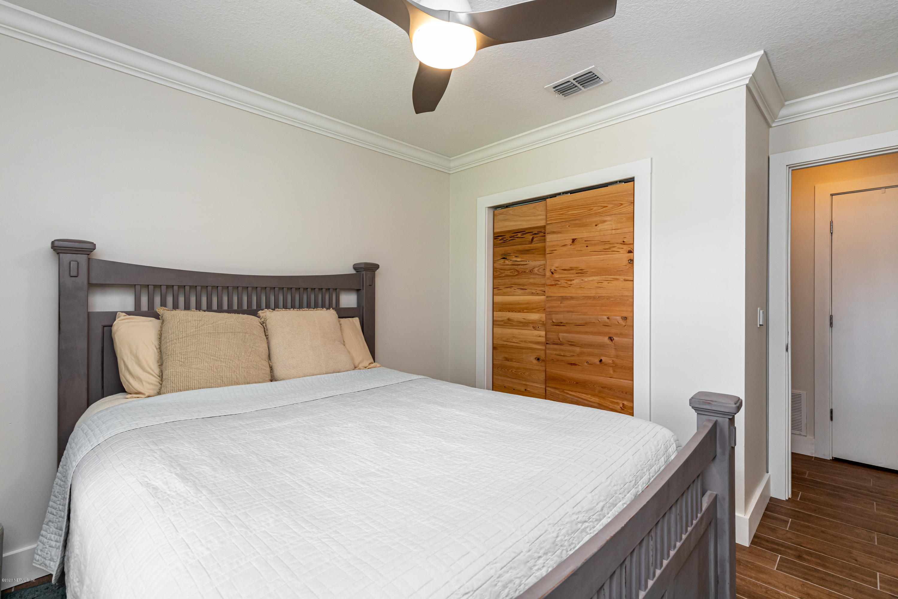 20 Amberjack Road Ponte Vedra Beach, FL 32082 - Photo 27 of 37 a bedroom with a bed and a window