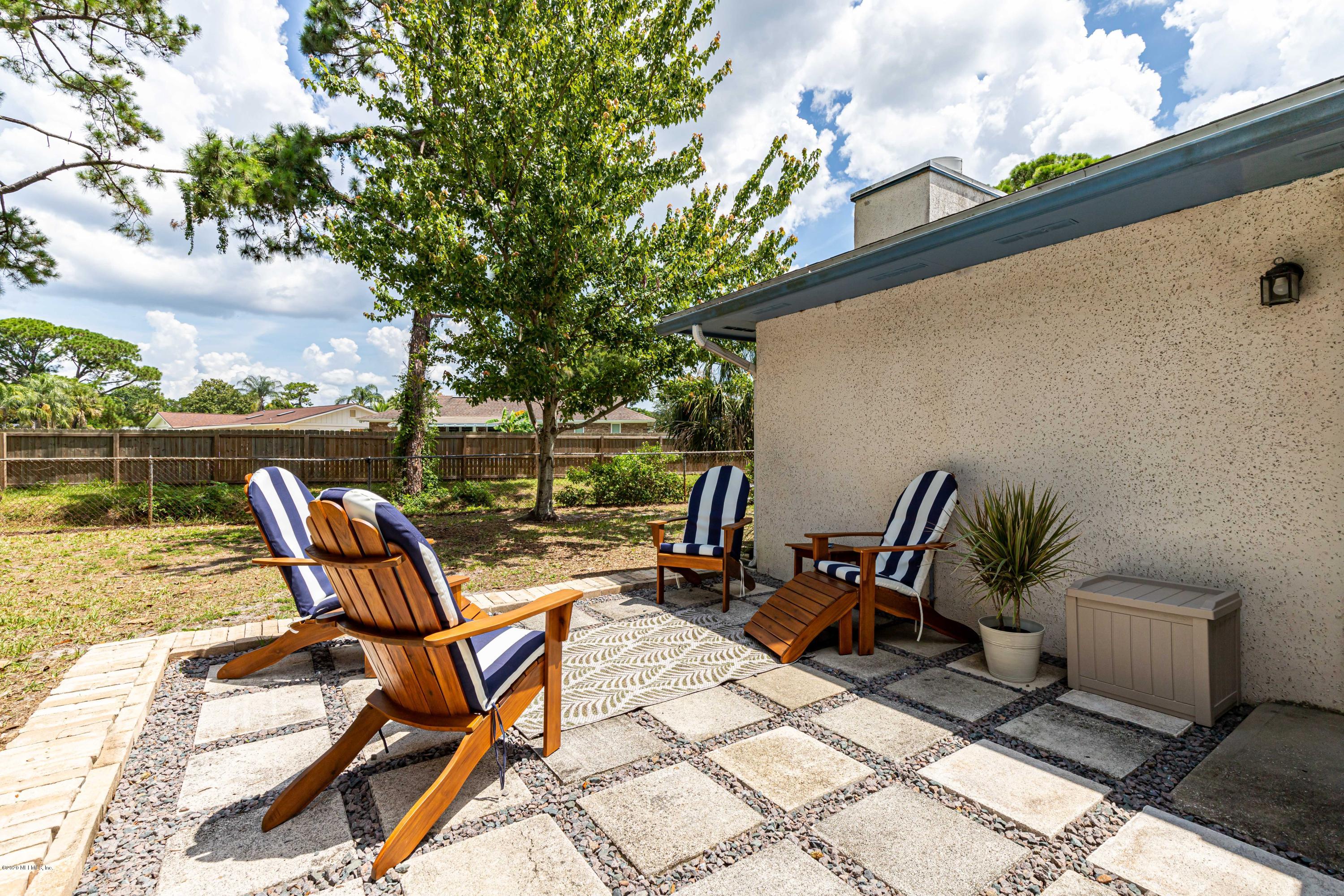 20 Amberjack Road Ponte Vedra Beach, FL 32082 - Photo 30 of 37 a view of a patio with chair and table on the terrace