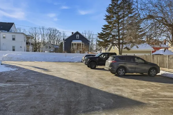 a view of a car parked in front of a house