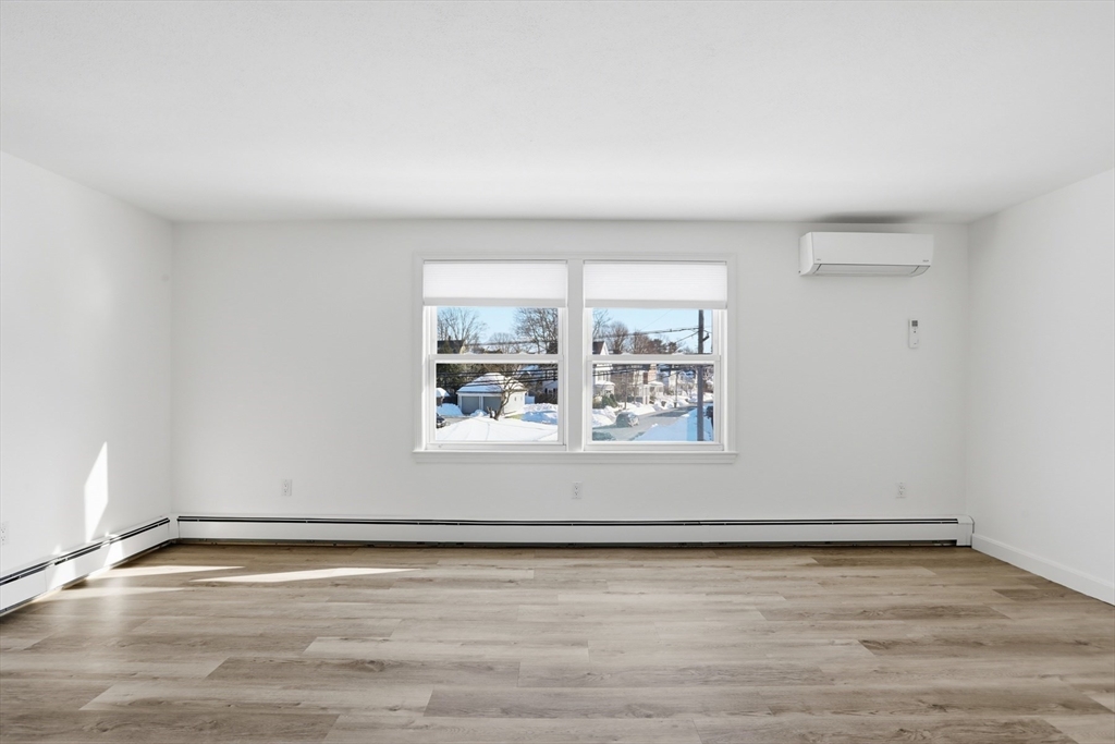 381 South Main Street, Unit 2 Haverhill, MA 01835 - Photo 4 of 18 a view of a room with wooden floor and window