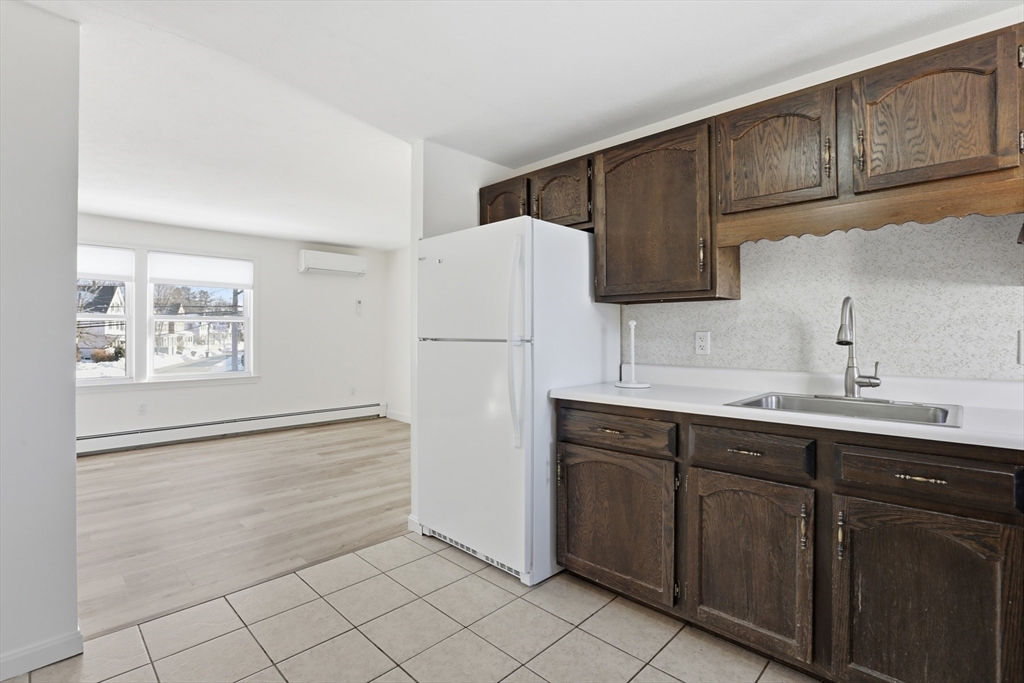 381 South Main Street, Unit 2 Haverhill, MA 01835 - Photo 8 of 18 a kitchen with a sink cabinets and stainless steel appliances
