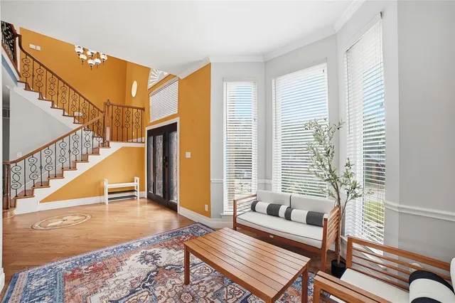a living room with furniture and a rug