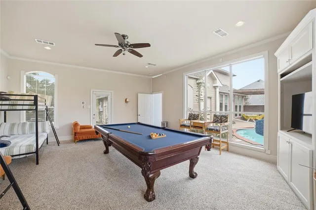a bathroom with a granite countertop toilet sink and mirror