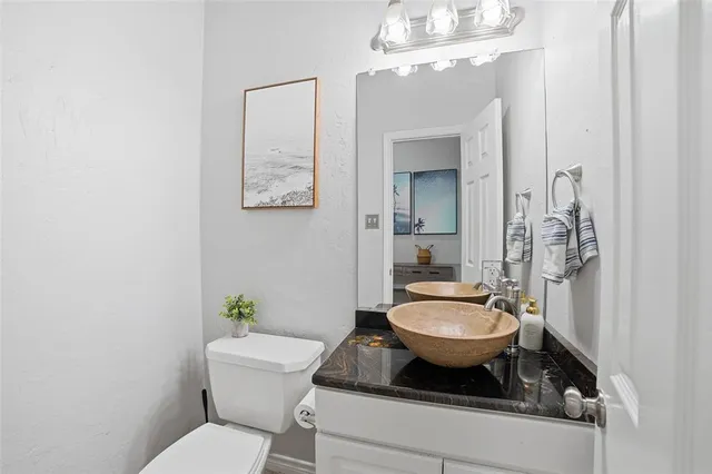 a bedroom with furniture and wooden floor