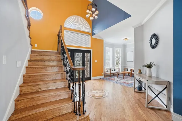 a view of an entryway with wooden floor