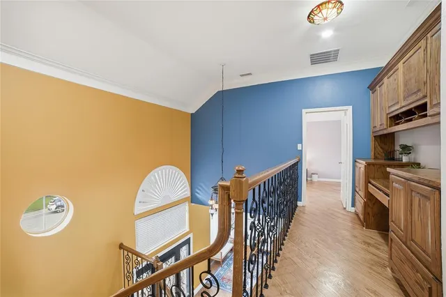 a bedroom with a bed couch and a window