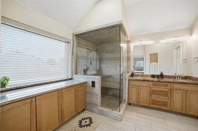 a bedroom with a bed and a table