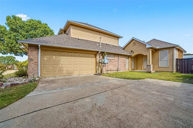 an aerial view of a house with a swimming pool