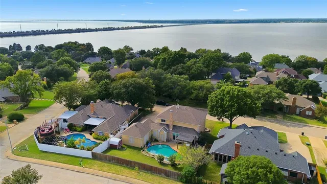 a living room with furniture a rug and a chandelier