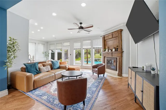 a kitchen with stainless steel appliances granite countertop a sink a stove and a refrigerator