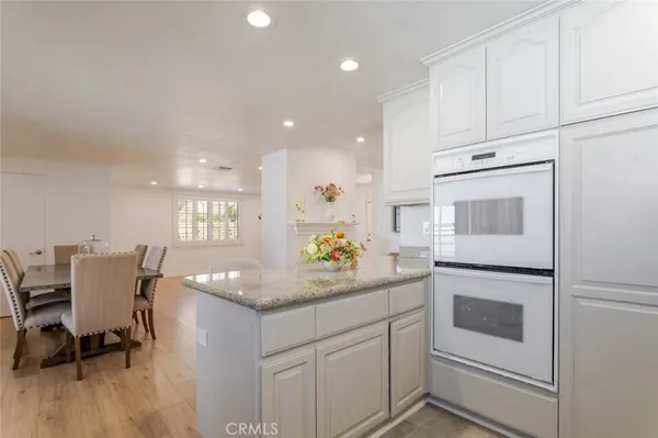 a kitchen with a sink cabinets and window