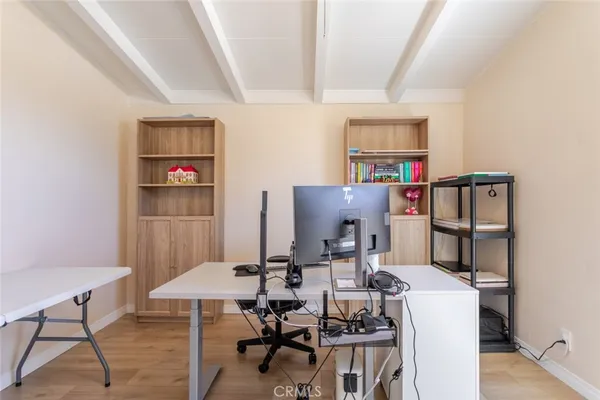 a workspace with furniture and wooden floor