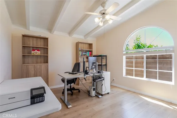 a view of a workspace with furniture and a workspace