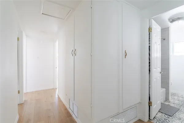 a view of a hallway with a shower