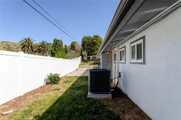 a view of house with backyard