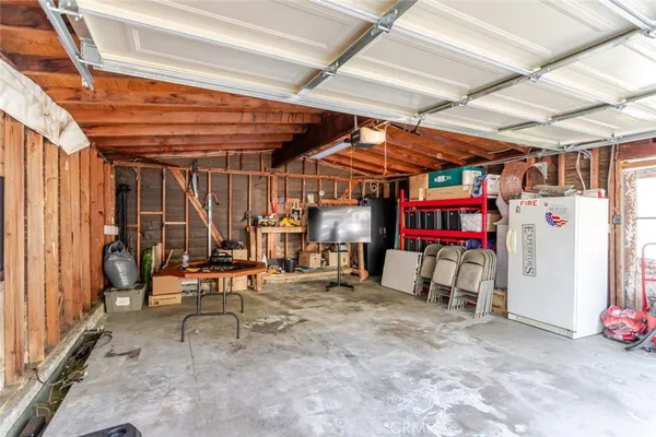 a view of a room with wooden shelves