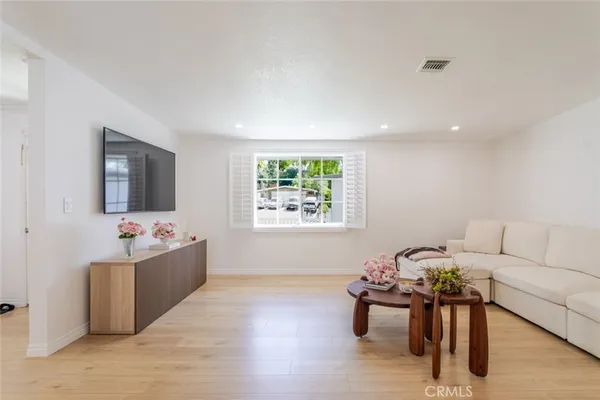 a living room with furniture and window