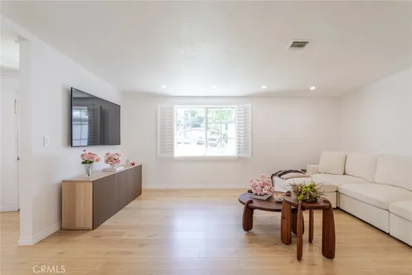 a living room with furniture and window