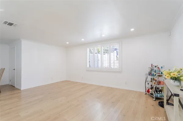 a view of a room with toys and wooden floor