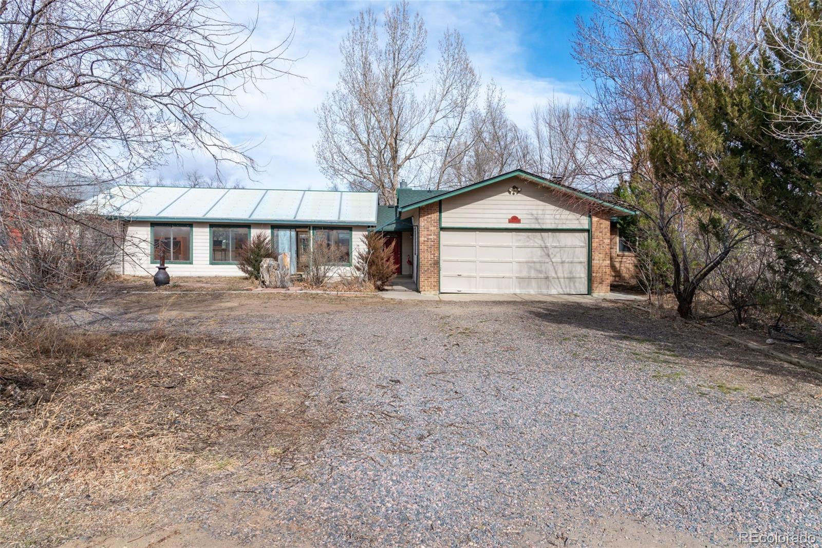 6263 Laodicea Road Longmont, CO 80503 - Photo 12 of 45 a front view of a house with a yard