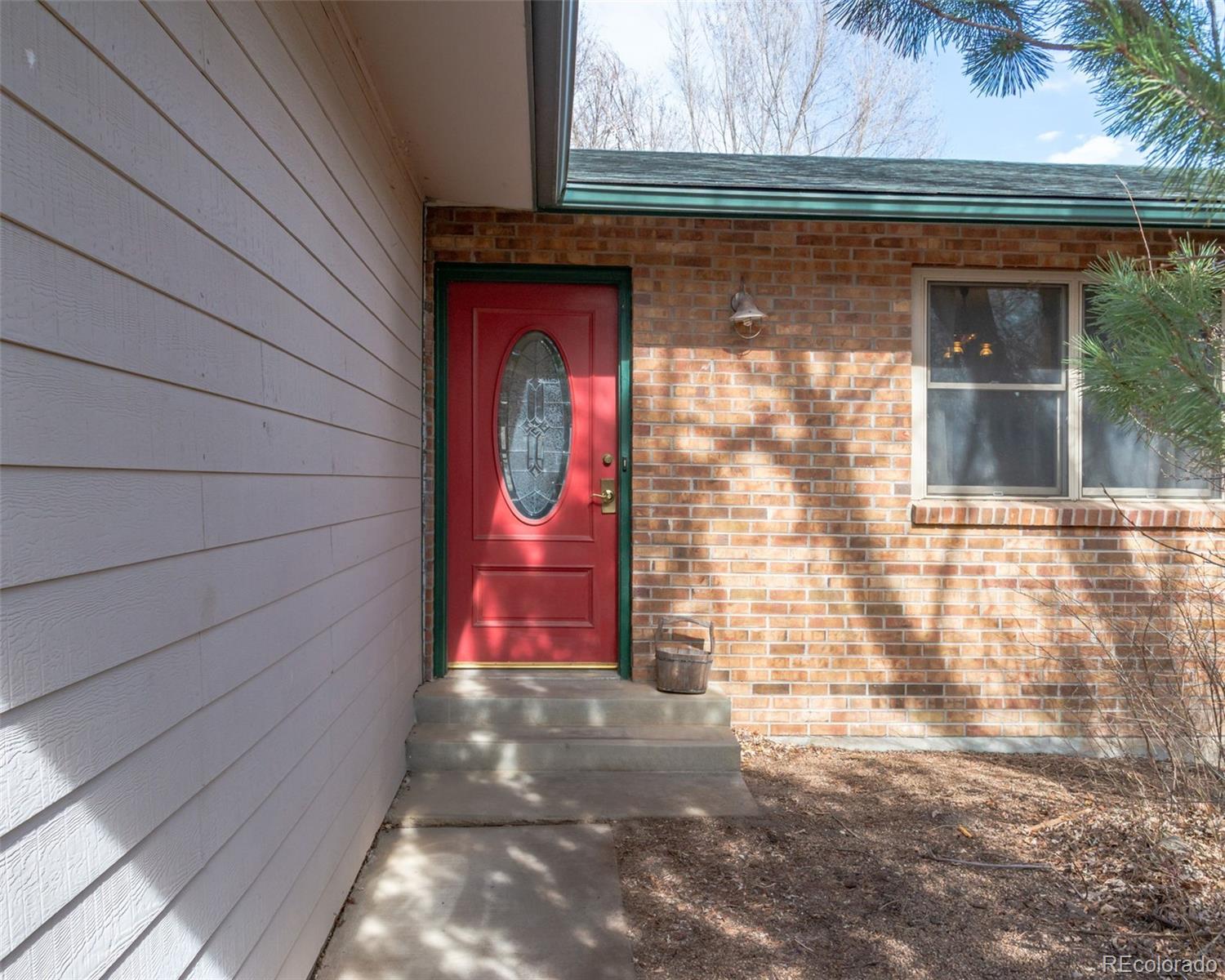 6263 Laodicea Road Longmont, CO 80503 - Photo 13 of 45 a view of entrance door of the house