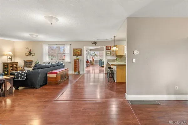 a view of a dining room with furniture and wooden floor