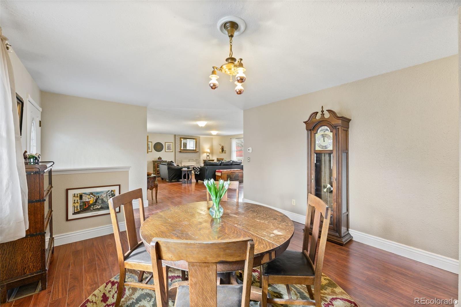6263 Laodicea Road Longmont, CO 80503 - Photo 17 of 45 a view of a dining room with furniture and wooden floor