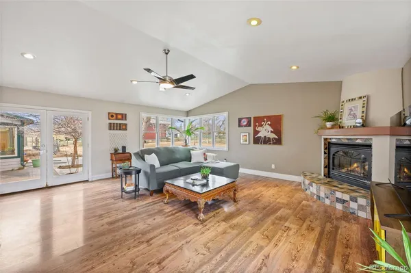 a bathroom with a sink a toilet a mirror and shower