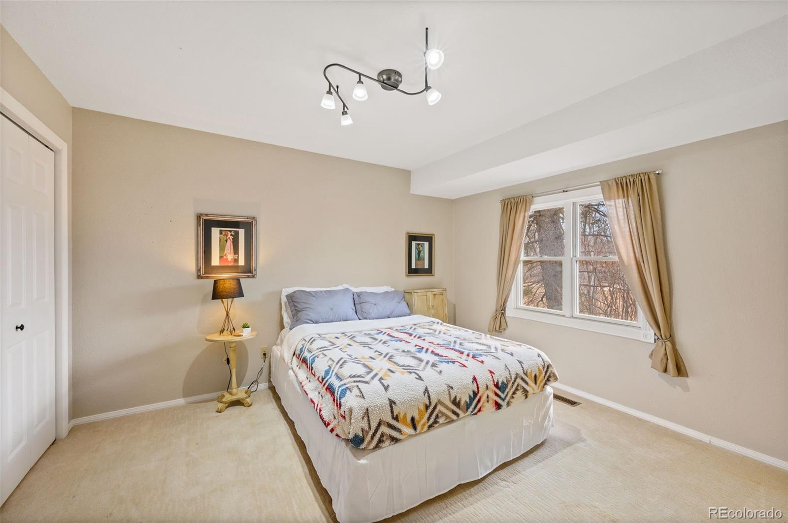 6263 Laodicea Road Longmont, CO 80503 - Photo 39 of 45 a bedroom with a bed and a window