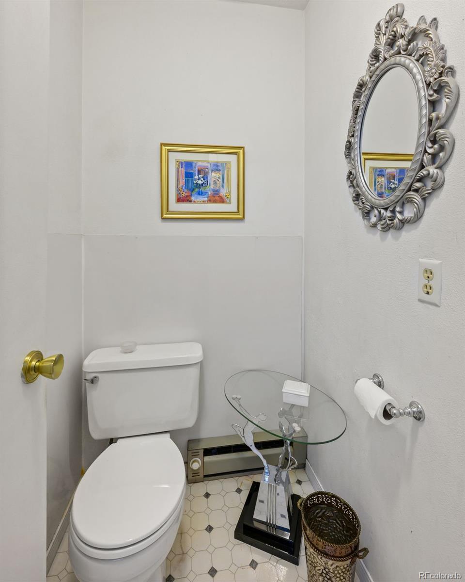 6263 Laodicea Road Longmont, CO 80503 - Photo 41 of 45 a white toilet sitting next to a bathroom sink